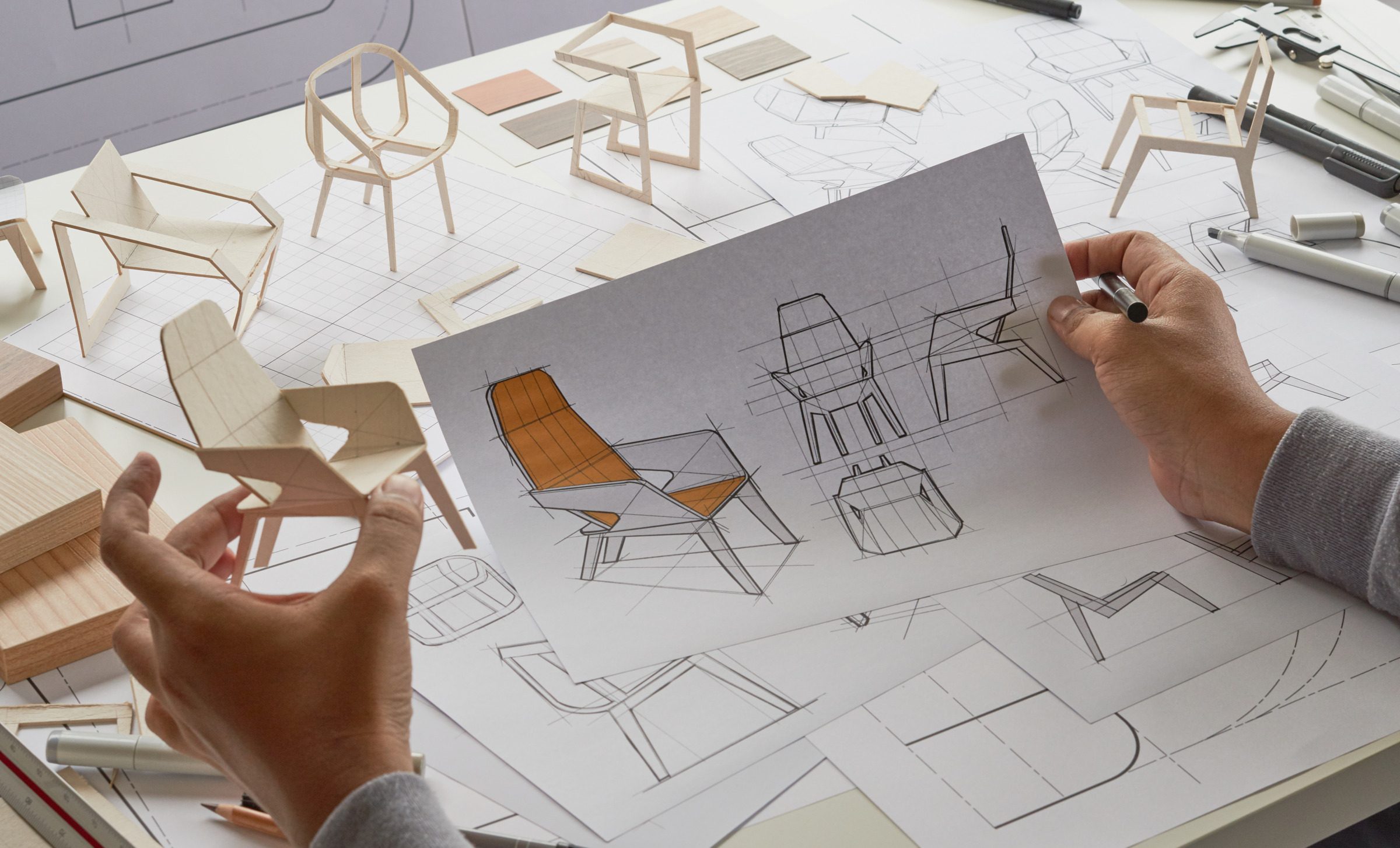 Designer sketching drawing design development product plan draft chair armchair Wingback Interior furniture prototype manufacturing production. designer studio concept .